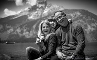 black and white family portrait laughing in front of teton mountains by Richard Horst Photography