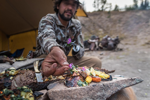 backcountry chef cooking with wild herbs over open fire in wilderness fine art photograph by Richard Horst