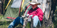 cowboy resting at camp with tent in background fine art western photograph by Richard Horst